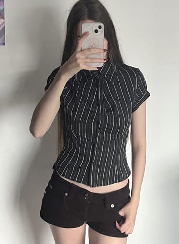 Reviewer in a mirror selfie wearing the Valeria Grunge Pinstripe Ruched Shirt Top, showing its fitted style.