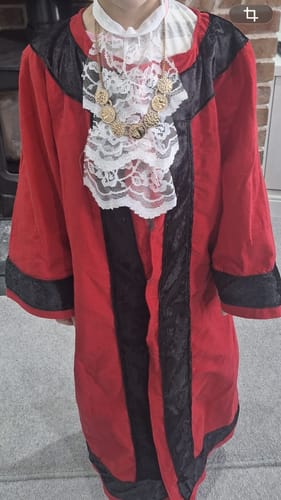 Customer's handmade mayoral robe for a child, featuring black Crushed Velvet Fabric trim.