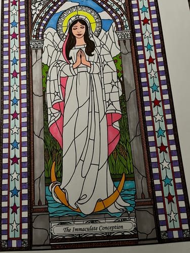 Reviewer shows a partially colored drawing in a stained-glass style, a hobby mentioned in the review.