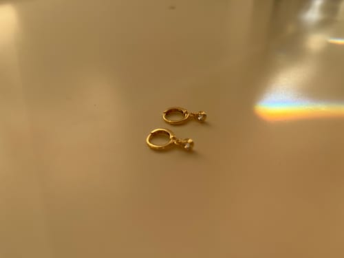 Customer photo review of Molly Gold Crystal Huggie Hoops