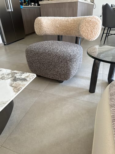 Customer's Duke Lounge Chair with a cream bouclé back and dark grey bouclé seat in their living room.