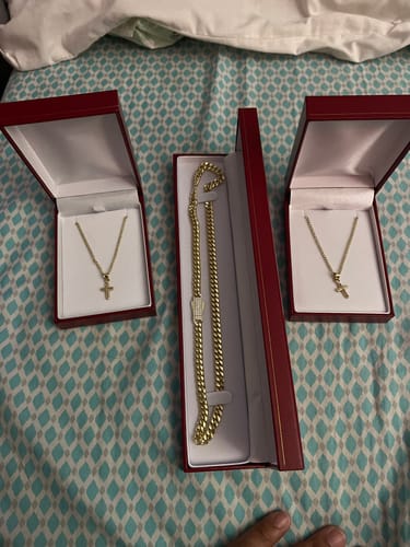Customer's 14k Hollow Cuban Choker in its open red box, shown with two other gold necklaces in their boxes.