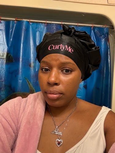 Customer photo review of CurlyMe Layered Cut Pre-Bleached Body Wave Pre-Cut HD Lace Wear Go Glueless Wigs