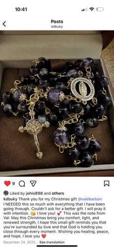 Reviewer's Our Lady of Guadalupe & Crucifix Rosary with purple crystal beads and gold accents displayed in a box.