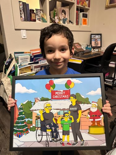 Customer's child holding a framed 'Turn Me Yellow' digital portrait of their family in a festive Christmas scene.