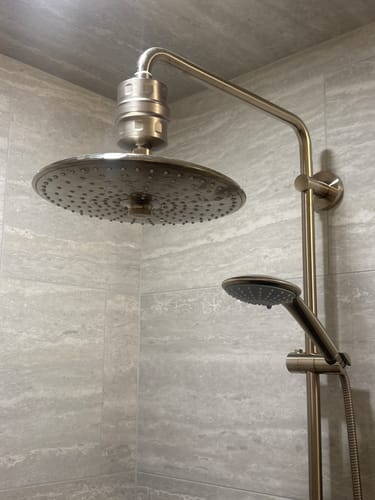 Customer's brushed nickel Shower Head Filter installed with a large rain shower head.