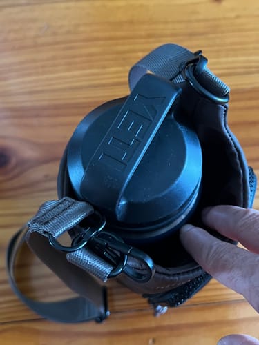 Close-up from above of the Miami Water Bottle Bag, showing a black Yeti bottle with extra space inside.