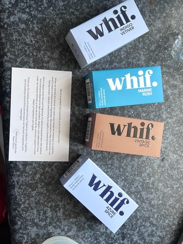 Reviewer's view of the packaging for a giveaway entry, showing four different whif. fragrance boxes.