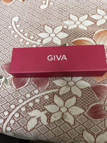 Customer's pink GIVA box for the Silver Infinity Zircon Anklet, shown closed on a patterned surface.