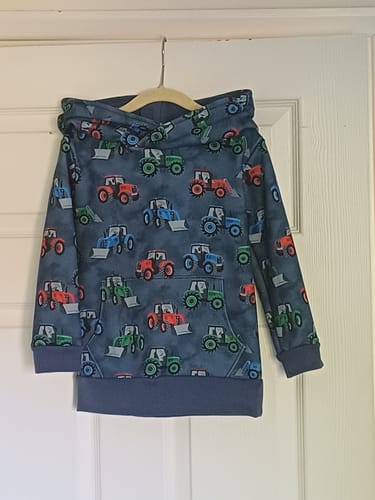 Reviewer's finished hoodie made from the blue Tractor Town Sweatshirt Fabric.