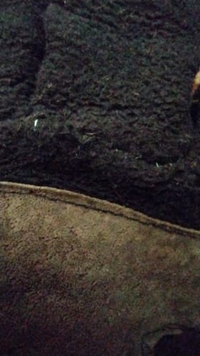 Reviewer shows a close-up of a sturdy repair on a glove made with Madeira Sensa Embroidery Thread.