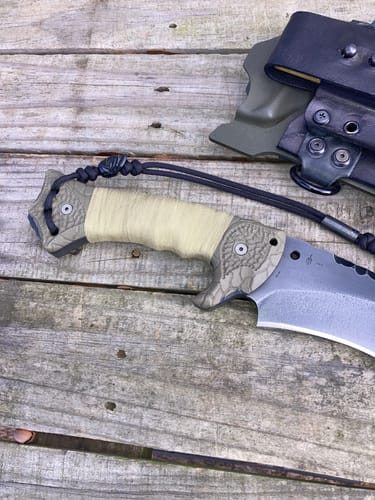 Close-up of a customer's Raid Tape wrapped around a textured knife handle for a comfortable grip.