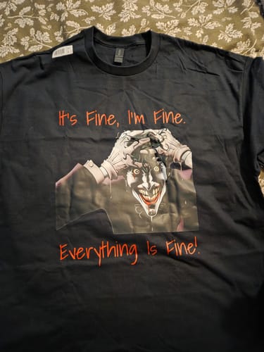 Customer's black unisex t-shirt with a custom Joker graphic and red text saying 'It's Fine, I'm Fine. Everything Is Fine!'.