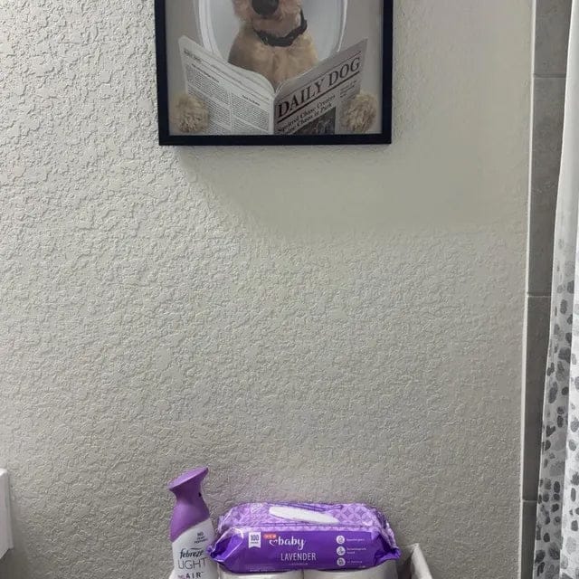 Customer photo review of Dog Reading Newspaper on toilet
