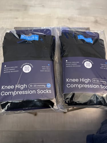 Customer's two new pairs of black Eucalyptus Compression Socks in their original packaging.