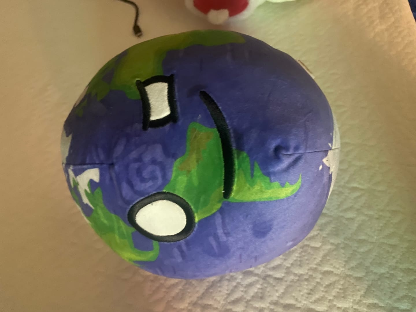 Customer photo review of The SolarBalls Earth Plush