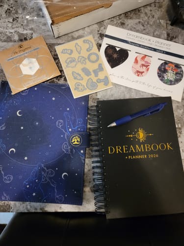 Reviewer's 2026 Dreambook + Planner Bundle, showing the planner, celestial cover, pen, stickers, and intention paper.