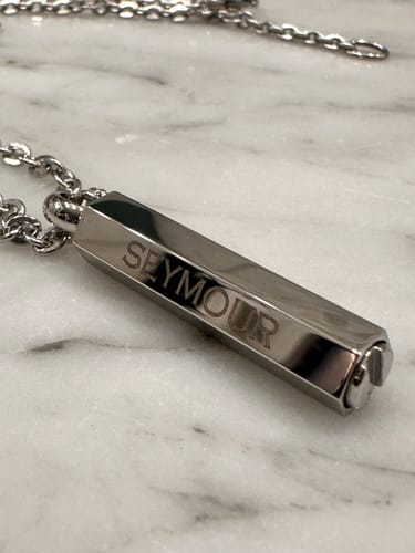Customer's stainless steel Modern Urn Pendant engraved with the name 'Seymour'.