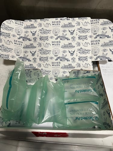 Reviewer shows the large shipping box for the Toddy paper filters, filled with plastic air pillows.