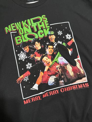 Customer's close-up of the black New Kids On The Block T-Shirt with the 'Merry, Merry Christmas' album art graphic.