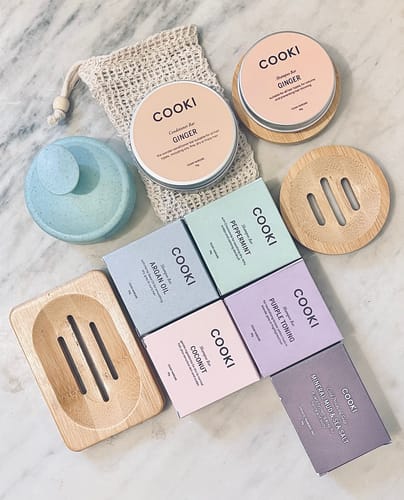 Customer's collection of Cooki products, including the Argan Oil Shampoo Bar box and bamboo soap dishes.