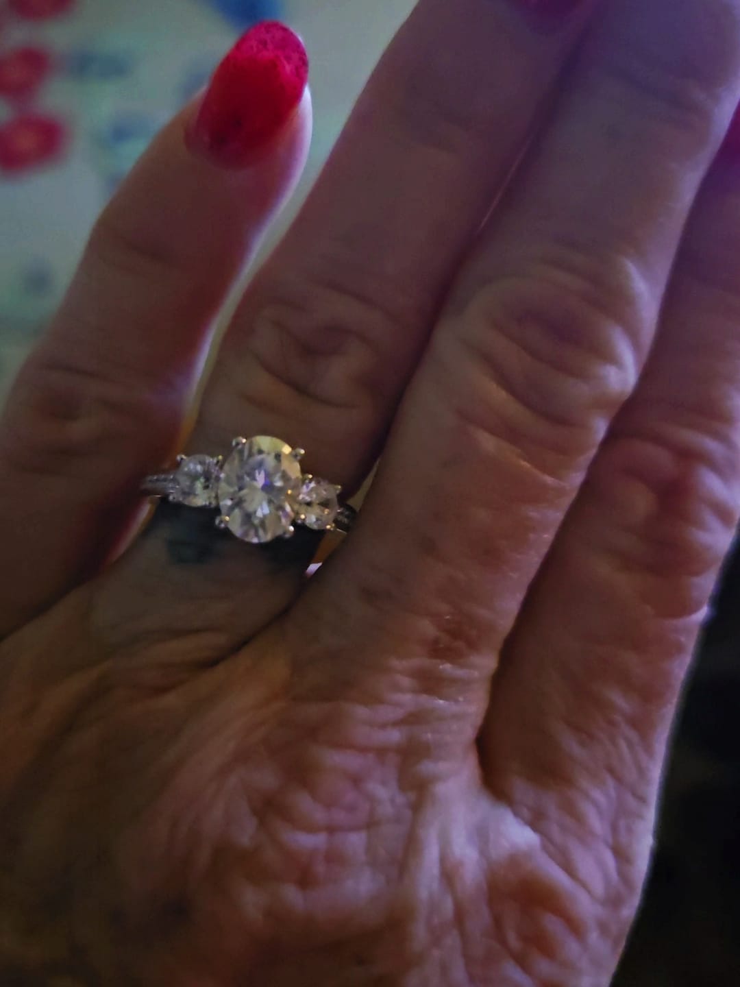Customer photo review of Three Stone Oval Moissanite Channel-Set Engagement Ring