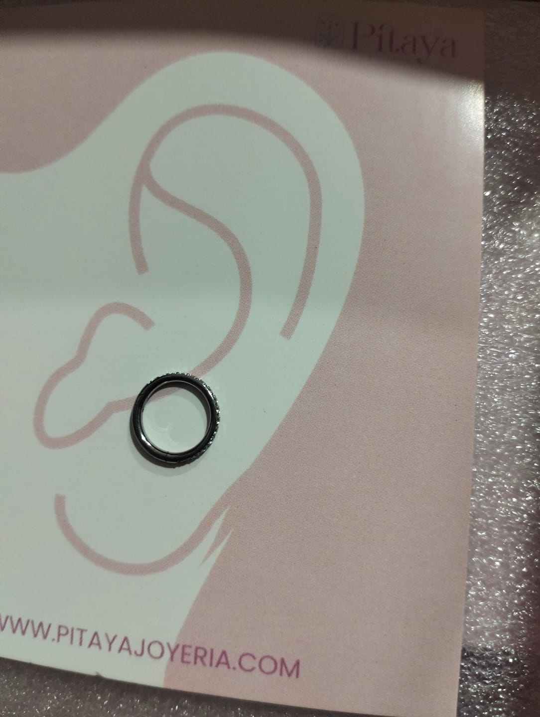 Customer photo review of Piercing Infinity con Zirconias Titanio
