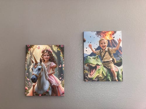 Reviewer's two custom portraits on a wall: 'The Enchanted Unicorn Princess' and another of a boy riding a dinosaur.