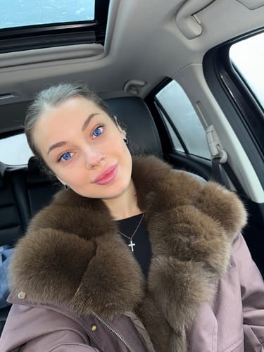 Customer wearing vibrant Cosplay Butterfly Blue Colored Contact Lenses while sitting in a car.