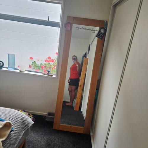 Reviewer taking a mirror selfie, showing their results after drinking Pink Lemonade.