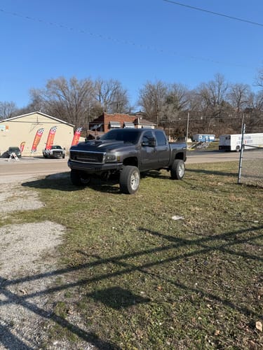 Customer's gray lifted truck with 2" Hubcentric Wheel Spacers installed, creating a wider stance.