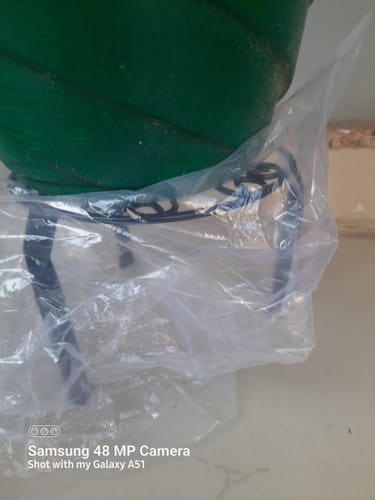 Customer photo review of UnitedCrafts Trivia Metal Pot Stand High Quality & Unique Design