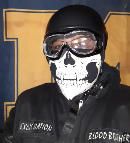 Reviewer wearing the black Maltese DOT SOA helmet, showing how it fits over their goggles and face mask.