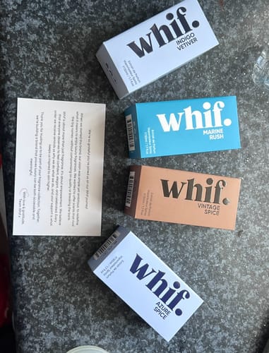 Customer's Azure Spice box on a counter with other whif. fragrance boxes.