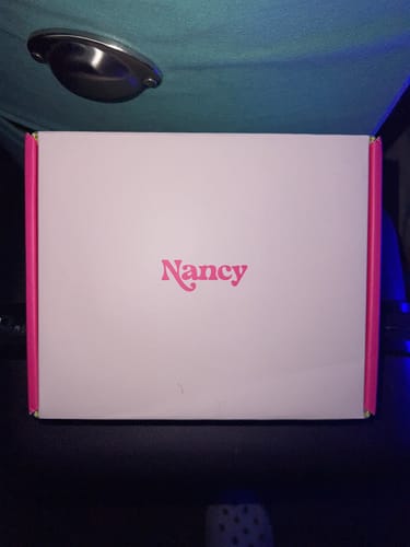 Customer's image of the white and pink box containing the Lem Clitoral Massager.