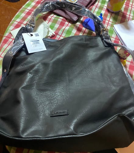 Reseña con foto de un cliente sobre Cartera De Hombro Notebook Hebillas