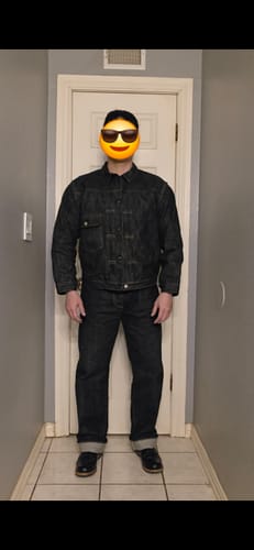 Reviewer standing indoors wearing the dark one-wash 47806XX Selvedge Denim Jacket with matching jeans.