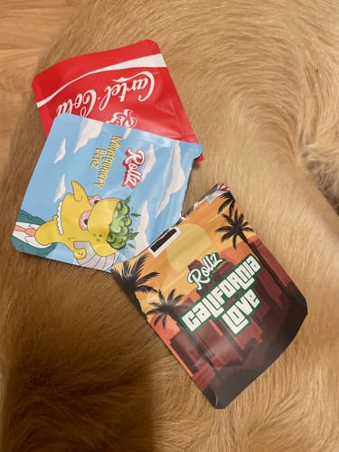 Customer's packaging for Cartel Cola THCA Flower shown with two other assorted product packages.