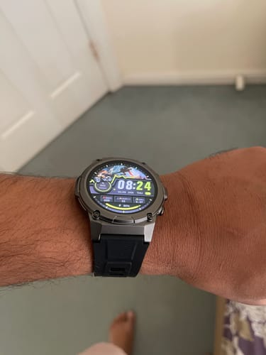 Customer's Gard Pro Ultra 3 smartwatch with a silver case and black strap on their wrist.