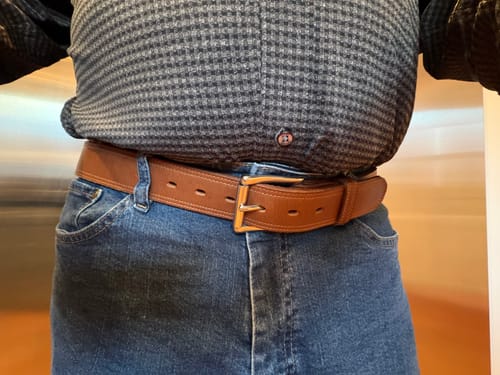 Reviewer wearing the brown Montana Bison Double Layer belt with blue jeans.