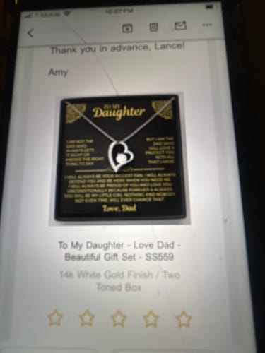 Reviewer's screenshot of the To My Daughter gift set, showing the heart-shaped necklace and message card inside its box.