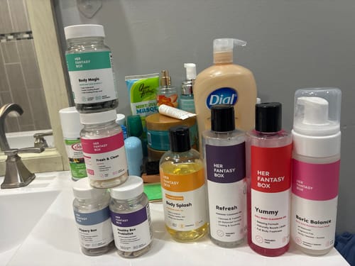 Reviewer's Everything Bundle hygiene and supplement products displayed on their bathroom sink.