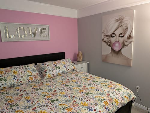 Customer's 'Marilyn Monroe' Framed Canvas hanging on a stylish bedroom wall.