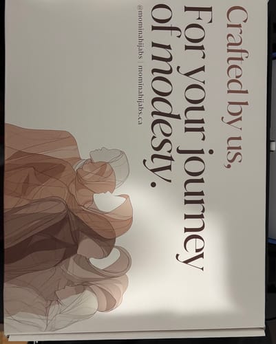 Reviewer shows the branded card from their Premium Maxi Jersey Hijab order, featuring illustrations.