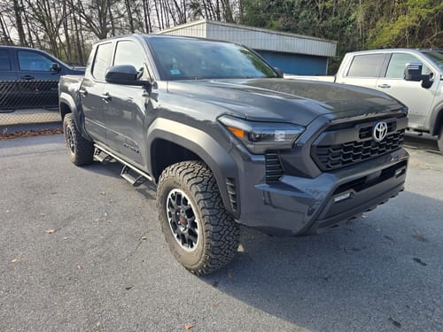 Customer's gray Toyota Tacoma with a wider stance after installing 1 inch forged wheel spacers.