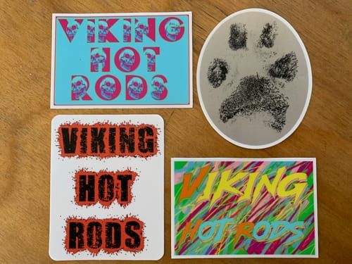 Customer's four varied custom stickers, including three "Viking Hot Rods" and one paw print.