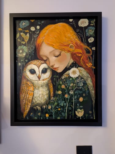 Reviewer's finished 'The Watchful Perch' paint-by-numbers kit. The framed painting shows a girl resting her head near an owl.