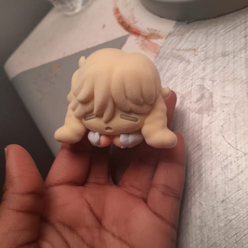 A reviewer holds the soft-textured Luka figure from the Alien Stage Rabbit Series Blind Box in their hand.