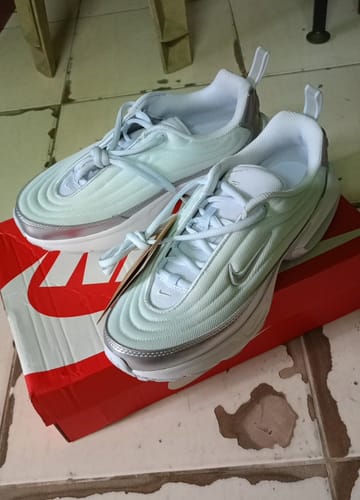 Customer's Nike Air Max Portal SE shoes in a light blue quilted style, shown resting on top of their shoebox.