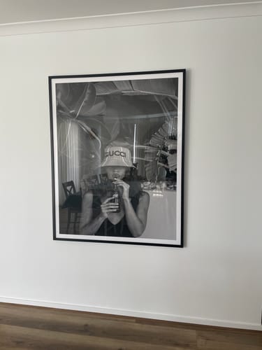 Customer's Summer Cola Art Print in a black frame, hanging on a white wall in their family room.